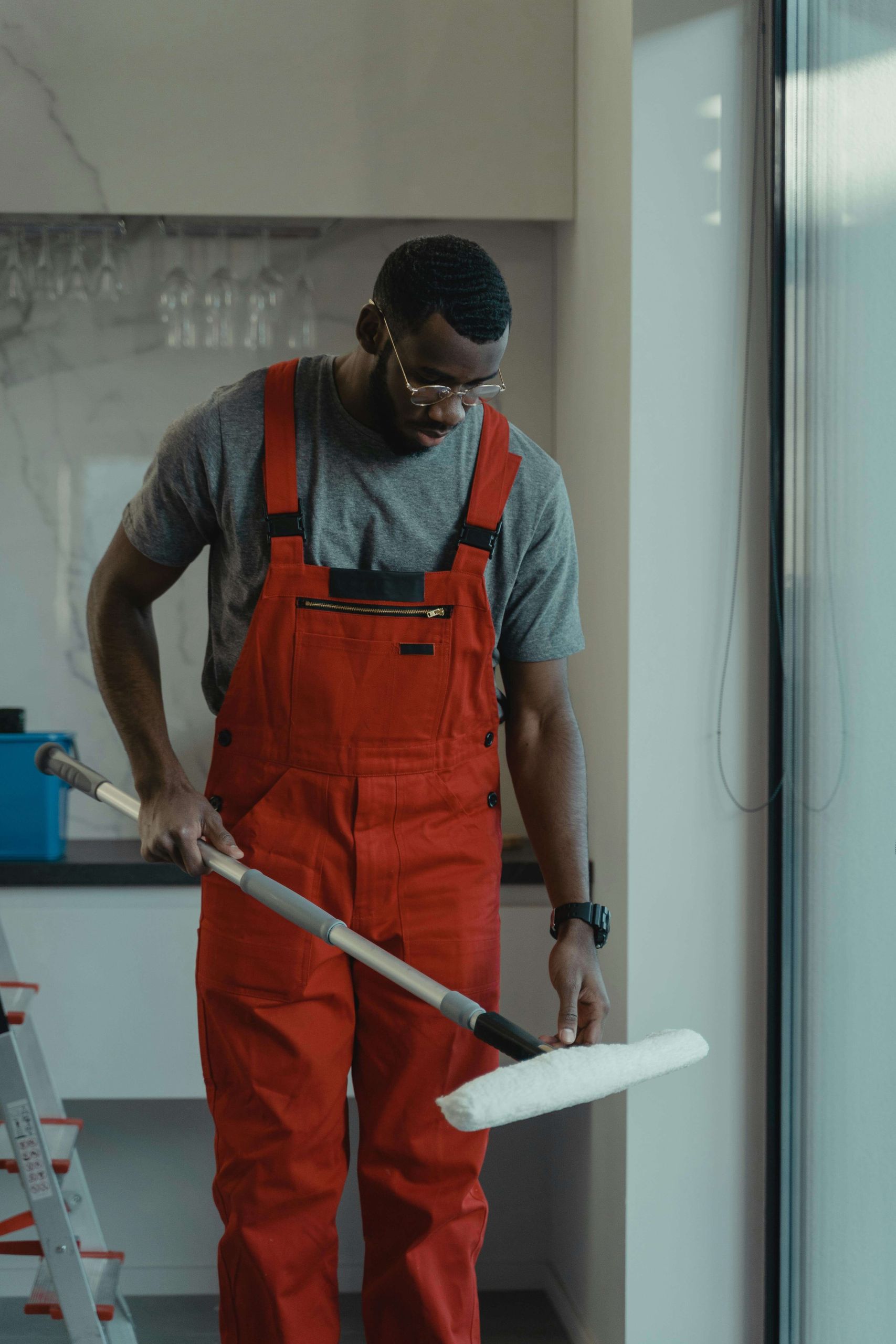 Man cleaning a building